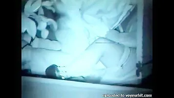 films lovebirds having sex at night outside in clothing.