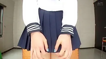Japanese schoolgirl cosplayer plays with her pussy through her white panties