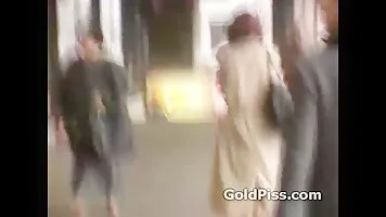 Sexy redhead is desperate in finding a good spot for peeing in public